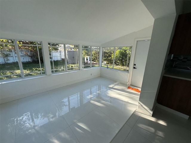 sunroom / solarium with vaulted ceiling