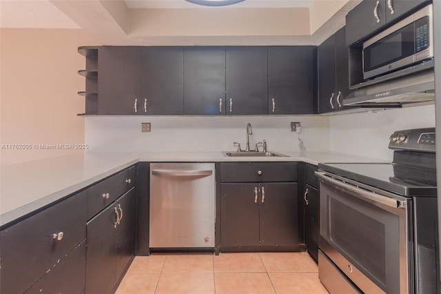 kitchen with open shelves, light tile patterned flooring, a sink, stainless steel appliances, and light countertops