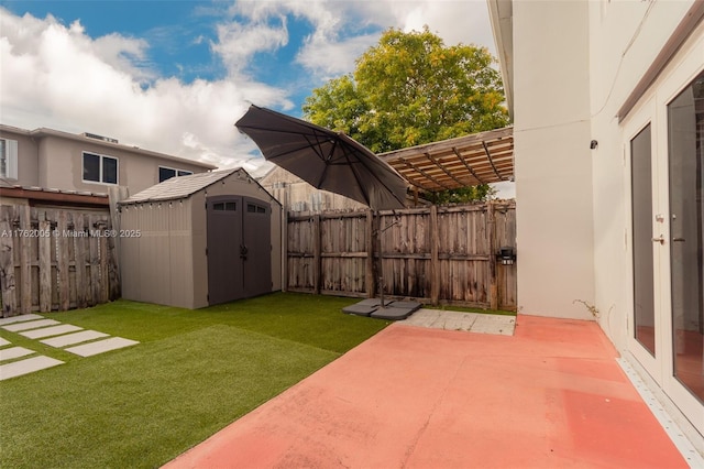 view of yard featuring a pergola, a patio, a fenced backyard, a shed, and an outdoor structure