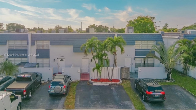 view of building exterior with a fenced front yard