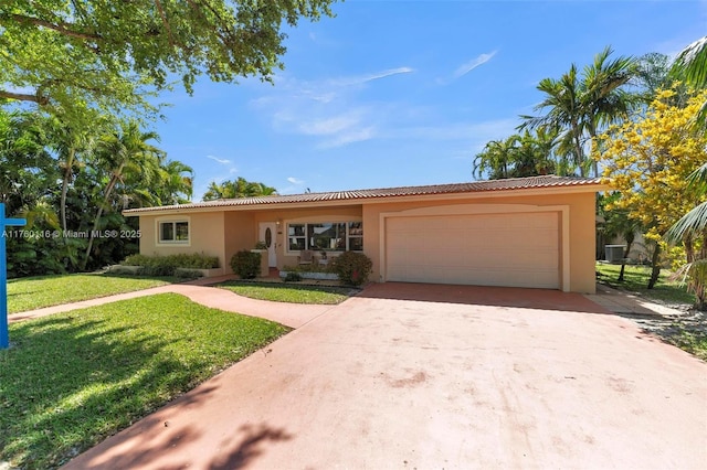 ranch-style home featuring a front lawn, concrete driveway, a tile roof, stucco siding, and a garage