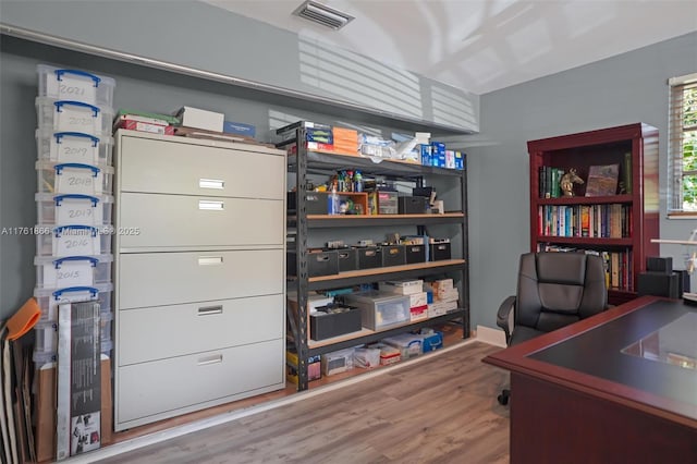 office area with wood finished floors and visible vents