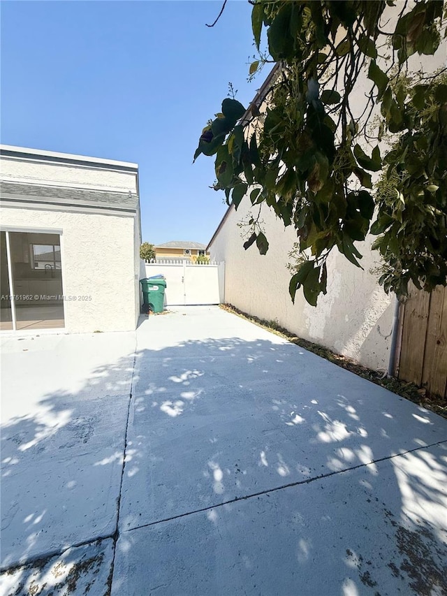 view of patio featuring fence