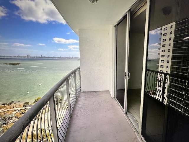 balcony featuring a water view