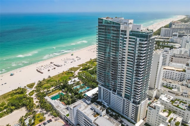 aerial view with a water view, a city view, and a view of the beach