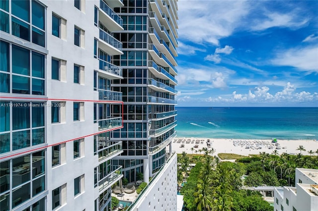 property view of water featuring a beach view