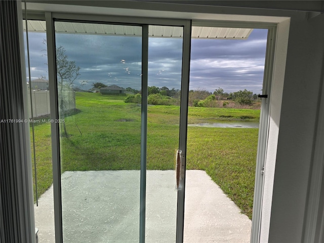 doorway to outside featuring a water view