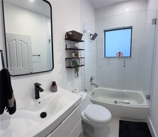 full bathroom featuring enclosed tub / shower combo, toilet, and vanity