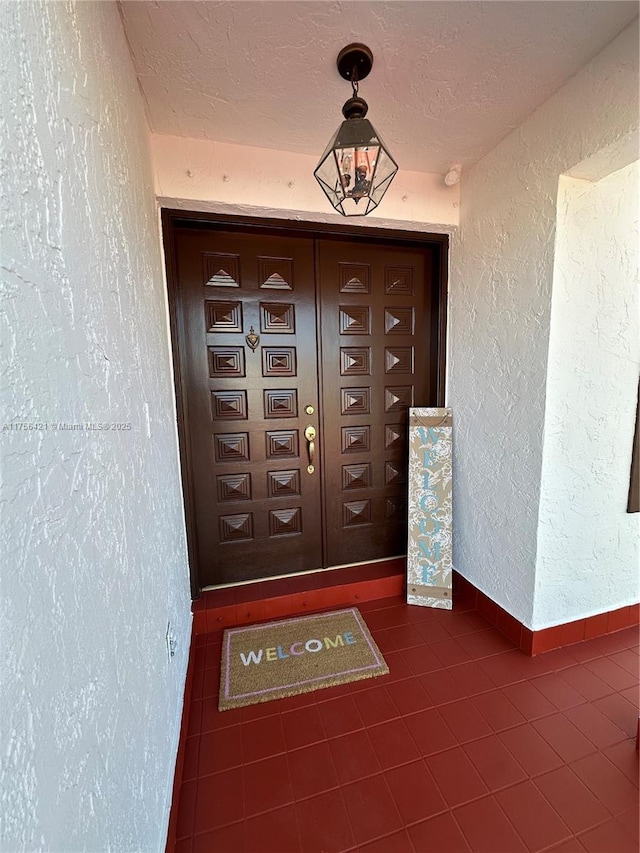 entrance to property with stucco siding