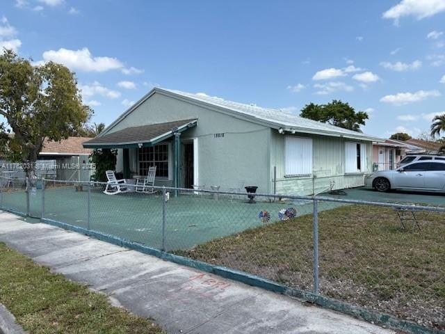 view of side of property featuring fence