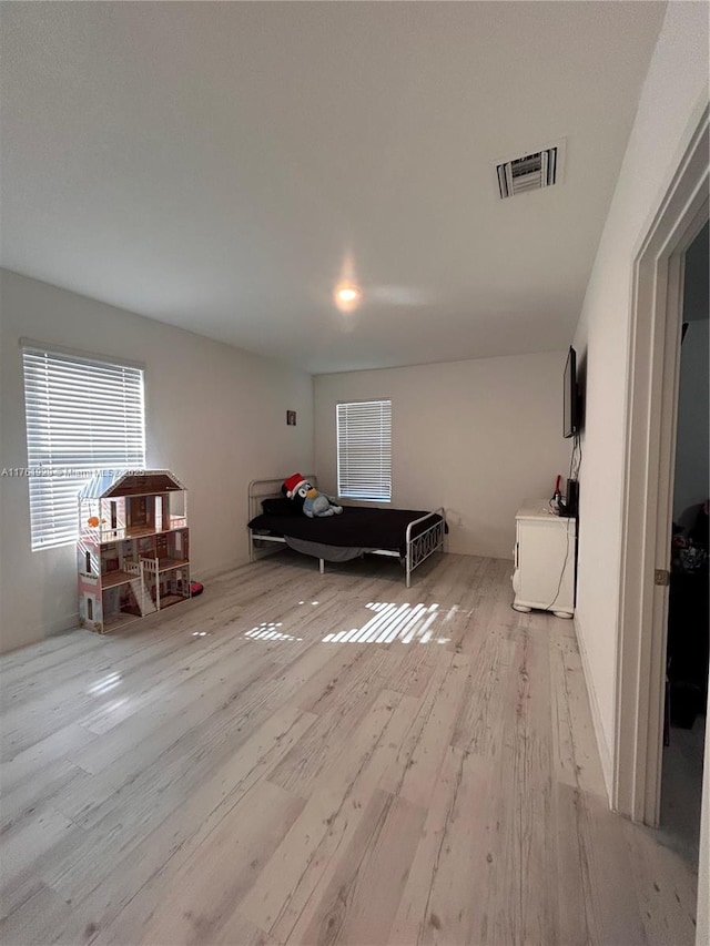 interior space featuring wood finished floors and visible vents