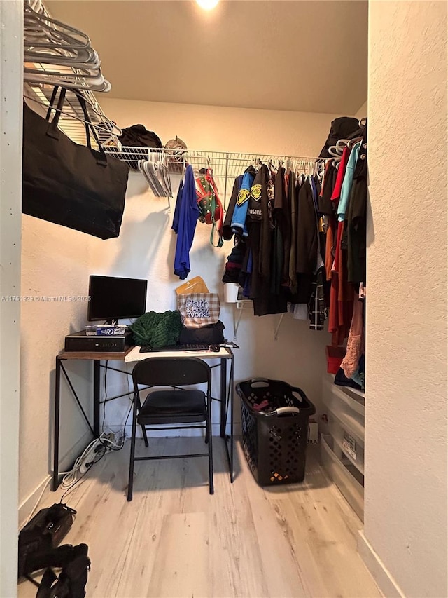 spacious closet featuring wood finished floors