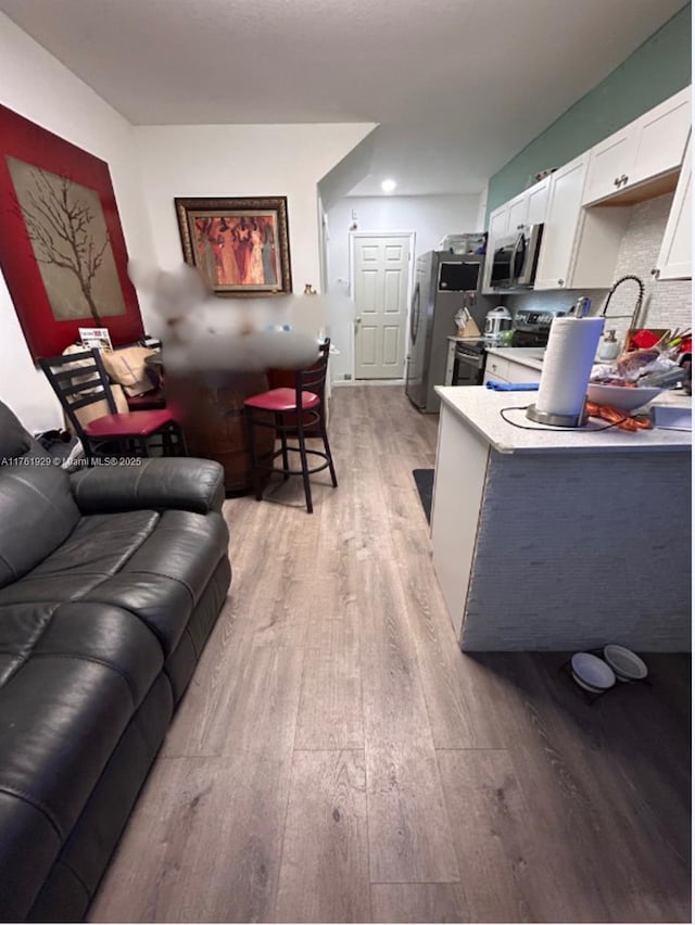 living room featuring light wood-type flooring