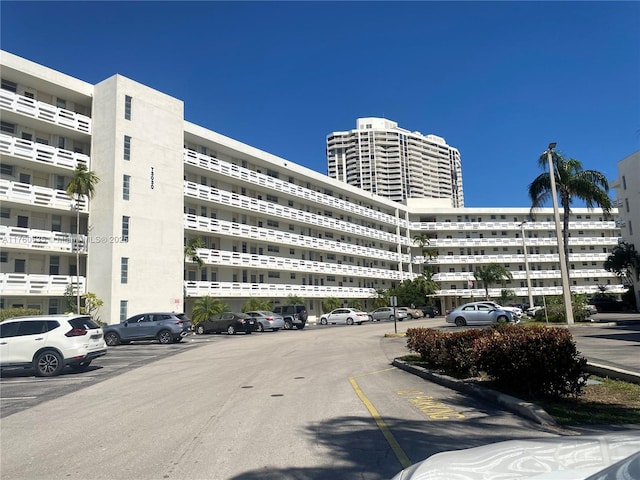 view of property with uncovered parking