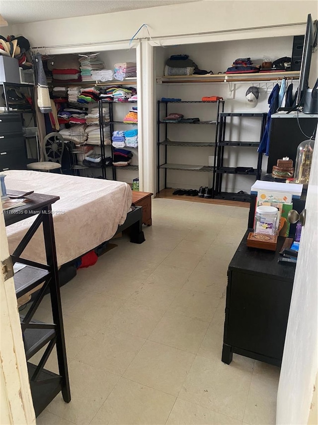 bedroom featuring tile patterned floors