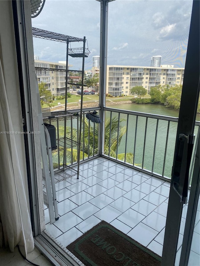 balcony featuring cooling unit and a city view