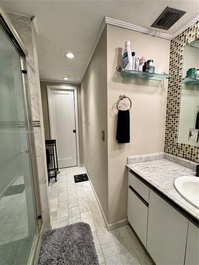 bathroom featuring visible vents, a stall shower, ornamental molding, decorative backsplash, and vanity