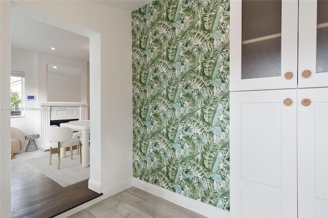 bathroom featuring baseboards and wood finished floors