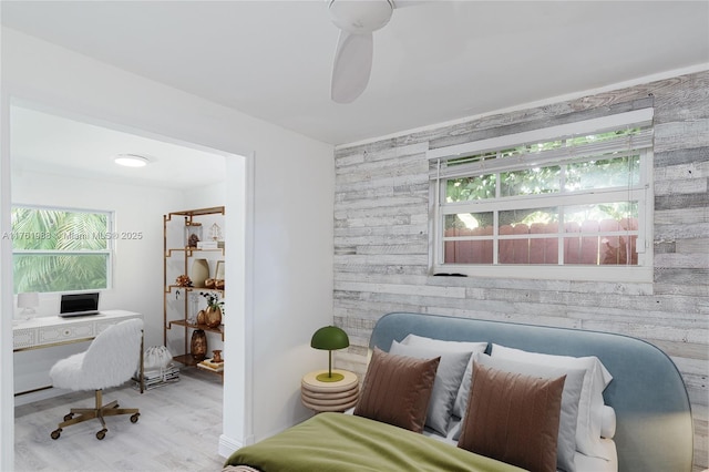 home office featuring wood walls and wood finished floors