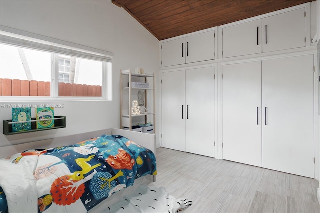 bedroom with wooden ceiling and vaulted ceiling