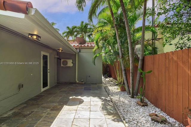 view of patio / terrace featuring fence