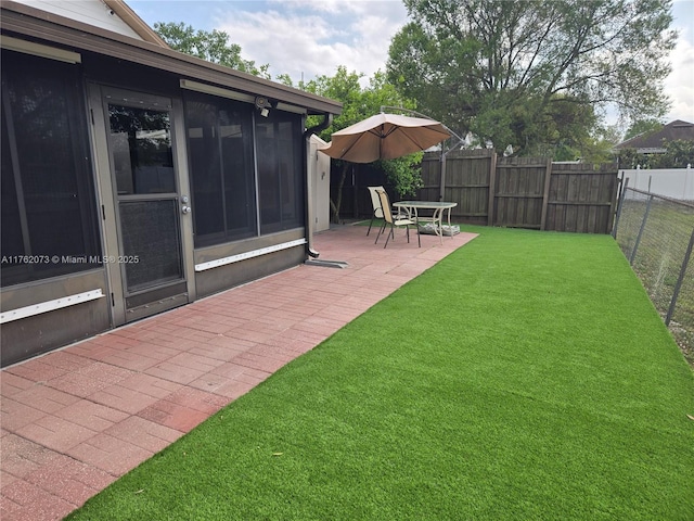 view of yard featuring a patio and a fenced backyard