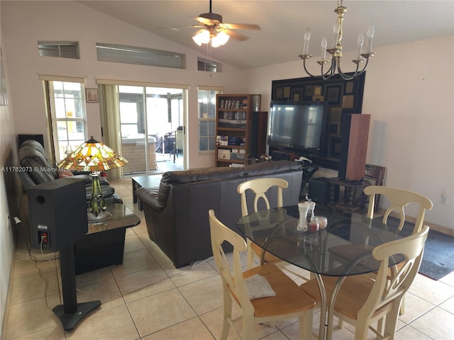 dining room featuring light tile patterned floors, visible vents, and vaulted ceiling