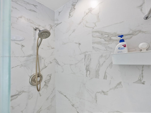 room details with a marble finish shower