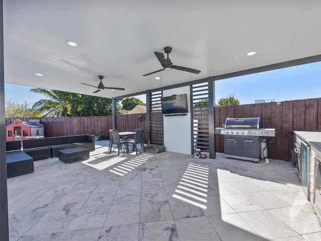 view of patio featuring a ceiling fan, an outdoor living space, a fenced backyard, outdoor dining area, and stairs