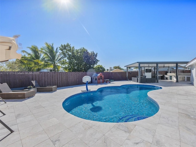 view of swimming pool featuring a fenced in pool, a fenced backyard, and a patio area