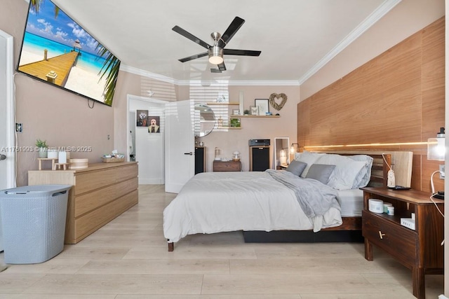 bedroom featuring ceiling fan, light wood-style floors, and ornamental molding