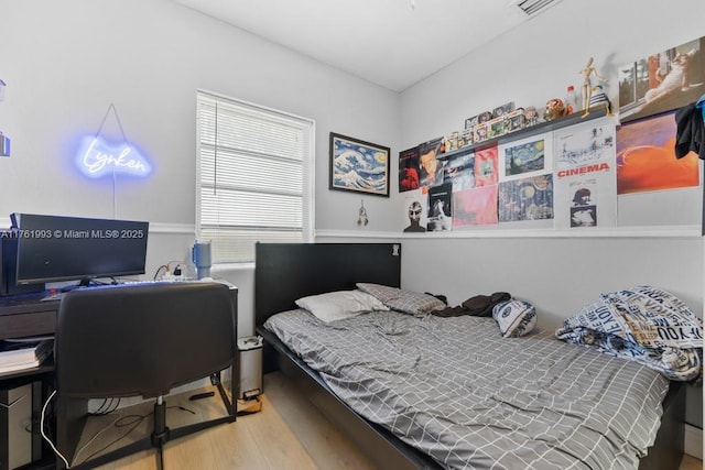 bedroom featuring wood finished floors