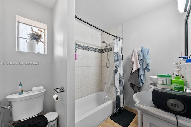 full bath with vanity, tile patterned floors, toilet, and shower / bath combo