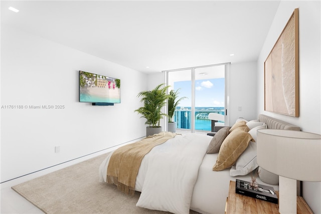 3301 NE 183rd St Unit Ph04, Aventura, FL 33160 - bedroom featuring access to exterior, a wall of windows, and recessed lighting