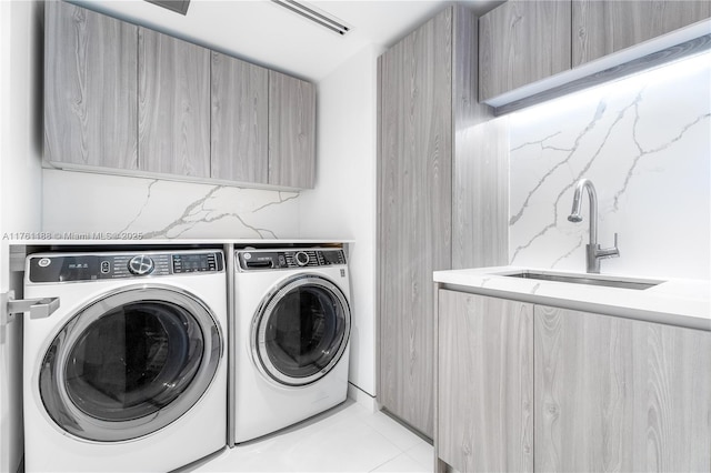 3301 NE 183rd St Unit Ph04, Aventura, FL 33160 - laundry room featuring separate washer and dryer, cabinet space, and light tile patterned flooring