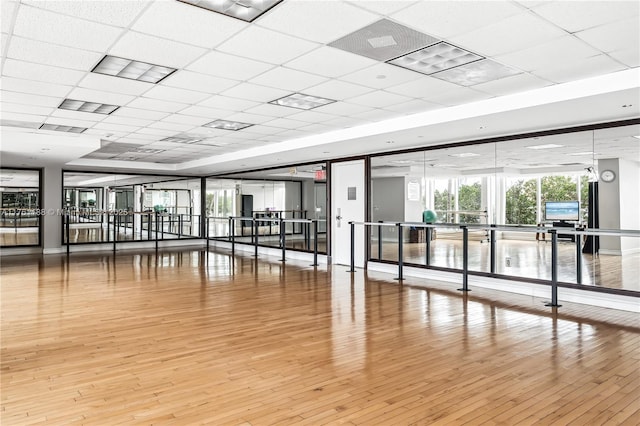 3301 NE 183rd St Unit Ph04, Aventura, FL 33160 - exercise room featuring a paneled ceiling, wood finished floors, and a tray ceiling