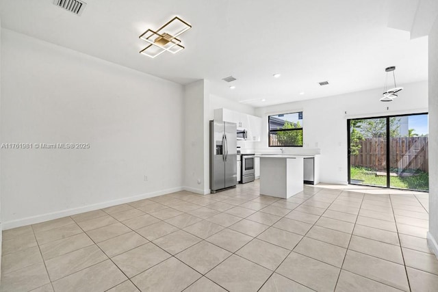 unfurnished living room featuring light tile patterned floors, visible vents, baseboards, and recessed lighting