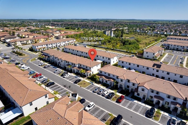 birds eye view of property with a residential view