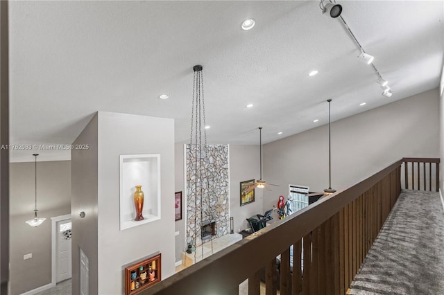 hallway featuring recessed lighting and track lighting
