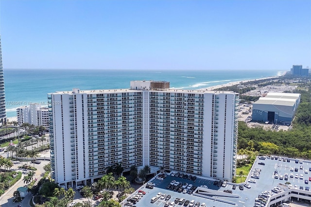 birds eye view of property featuring a view of city and a water view