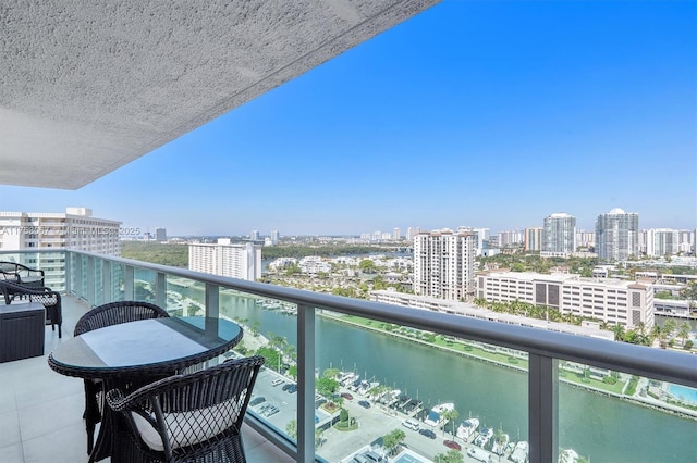 balcony with a city view and a water view