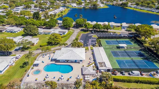 drone / aerial view featuring a water view and a residential view