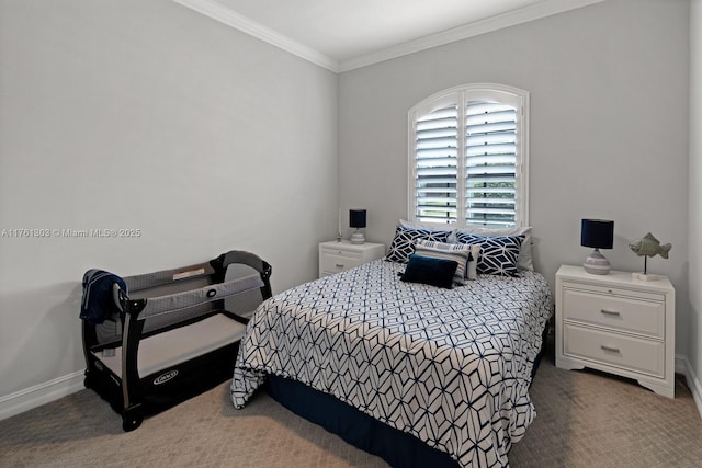 carpeted bedroom with baseboards and ornamental molding