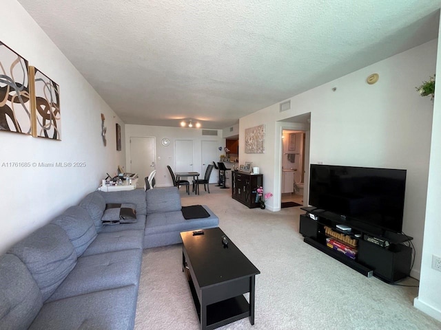 9066 SW 73rd Ct Unit 1002, Miami, FL 33156 - carpeted living area featuring a textured ceiling
