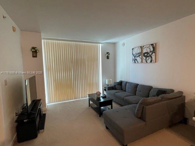 living room featuring light colored carpet