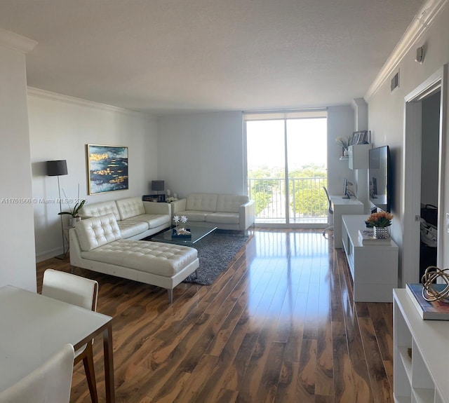 living room featuring a wall of windows, visible vents, dark wood-type flooring, and crown molding