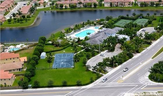 drone / aerial view with a residential view and a water view