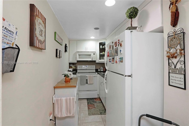 kitchen with white appliances, light tile patterned floors, recessed lighting, glass insert cabinets, and white cabinetry