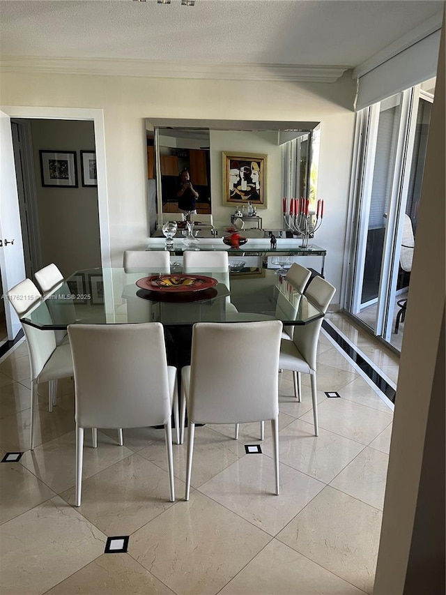 dining room featuring crown molding and a textured ceiling