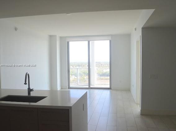 kitchen with a sink and light countertops